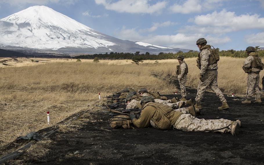 U.S. Marines with 1st Battalion, 3rd Marine Regiment, shoot their rifles to get a battle-sight zero at Continued Range 2 at Camp Fuji, Fuji, Japan, Feb. 18, 2016. 