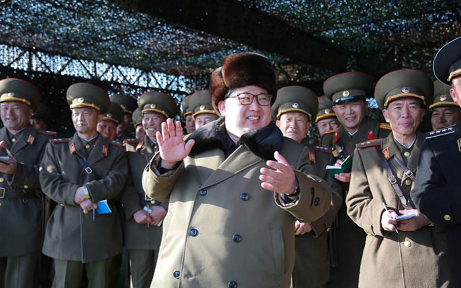 North Korean leader Kim Jong Un is flanked by his military leaders in this undated photograph from the Korean Central News Agency. On Tuesday, Mach 15, 2016, Un warned that his country soon would carry out another nuclear test and try out several types of ballistic missiles capable of carrying nuclear warheads.