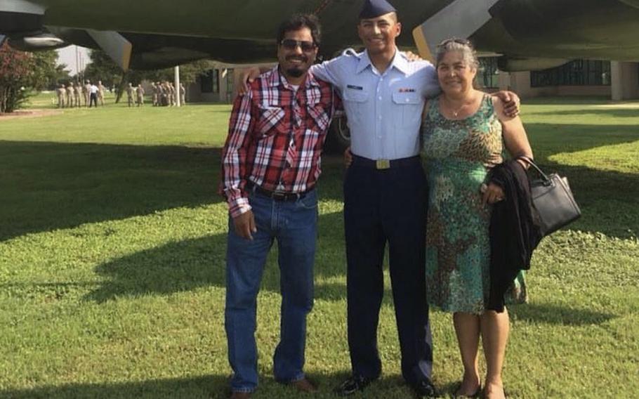 U.S. Air Force Staff Sgt. Caesar Flores, center, with his father, Andres Flores, and mother Juana Flores, who was deported to Mexico in 2018 after spending 30 years in the U.S.