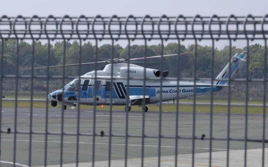 A Japan Coast Guard helicopter lands at Kumamoto Airport after dropping off medical personnel on Tuesday, April 29, 2016. The region was hit by a 6.5 magnitude quake on April 14, then with a 7.3 quake less than 24 hours later. 

