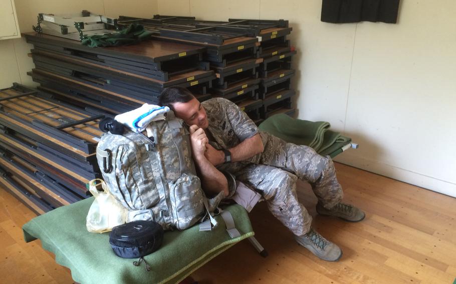U.S. Air Force Maj. Jack Beene, 43, rests after working from Sunday night to Tuesday afternoon to help U.S. Forces fly relief supplies to Kumamoto, Japan following a major earthquake. 

