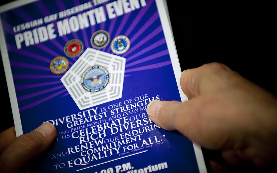 A pamphlet is held during a Pentagon Lesbian, Gay, Bisexual and Transgender Pride Month celebration event on June 26, 2012.