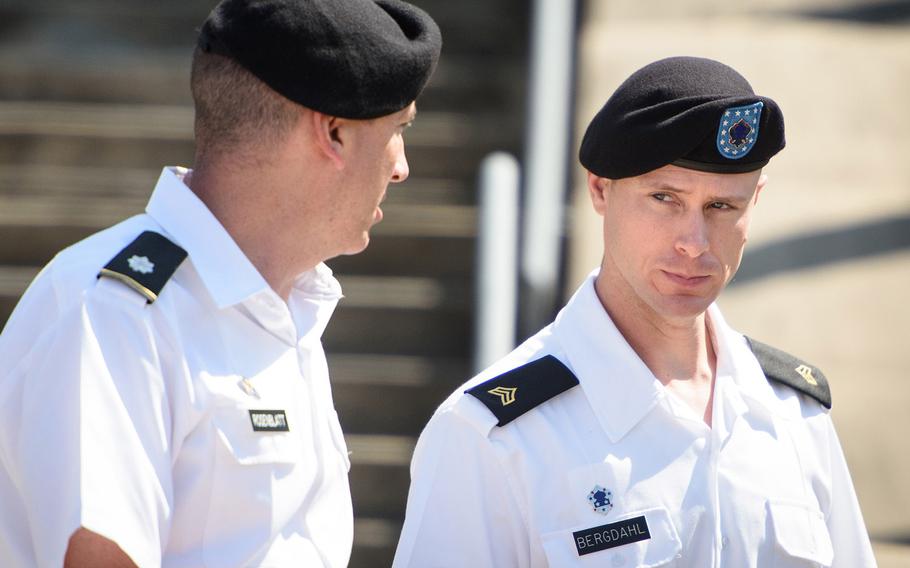 Sgt. Bowe Bergdahl, right, talks with his military attorney, Lt. Col. Franklin Rosenblatt after a hearing at Fort Bragg, N.C., on Aug. 24, 2016.