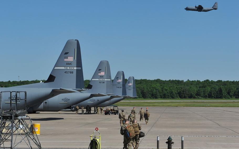 U.S. Air Force service members walk out to their aircraft for a routine deployment to Southeast Asia on April 5, 2016 from Little Rock Air Force Base, Ark. A new Air Force "climate survey" suggests that years of Pentagon downsizing and cuts driven by the congressional budget sequester have taken a toll on its military and civilian workers -- an issue the service's leaders have raised repeatedly.