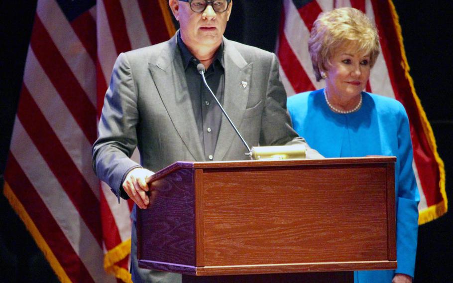 Actor Tom Hanks prepares to introduce U.S. Senator Elizabeth Dole to the audience at the Hidden Heroes campaign for military caregivers. Hanks is the chair for Hidden Heroes. 