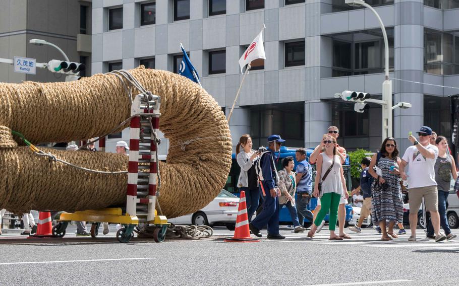 Hundreds battle 40-ton rope at world's largest tug-of-war on Okinawa