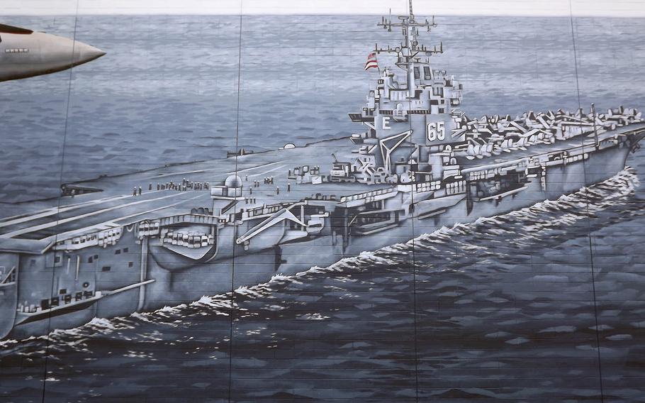 The iconic aircraft carrier USS Enterprise, depicted in a wall mural on a Virginia Beach building. 