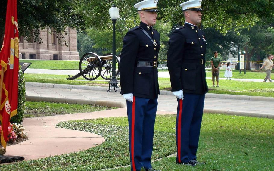 U.S. Marine Corps pilot Capt. Jake Frederick, 32, far left, was killed Wednesday in a F/A-18C crash off Japan. Joe Bob Frederick, right, swore in Jake Frederick, left, at his commissioning ceremony on the grounds of the Texas State Capitol. 