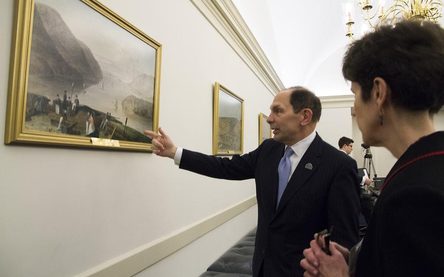 Secretary of Veterans Affairs Bob McDonald, a West Point graduate, explains Seth Eastman's 1875 painting, "Fort West Point," to VA official Dr. Carolyn Clancy before a hearing on Capitol Hill in 2015.