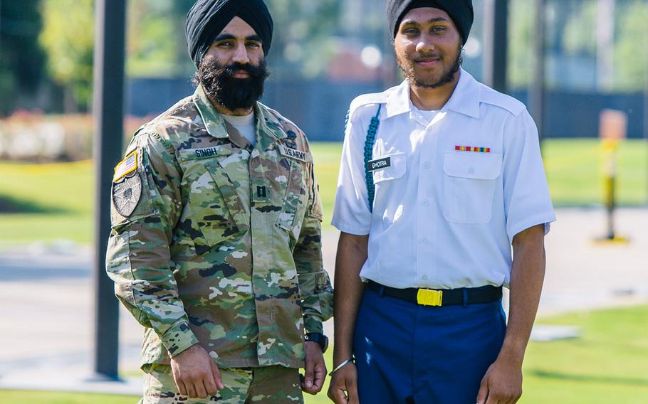 Army Capt. Simratpal Singh, left, is pictured with Pvt. Arjan Singh Ghotra in September 2016 as Ghotra graduated from One Station Unit Training at Fort Benning, Georgia. Singh, a West Point-educated engineering officer stationed at Fort Belvoir, Virginia, was granted a religious accommodation last year to wear a beard and turban in uniform, as directed by his Sikh faith. Ghotra was granted the same waiver later in 2016 just before he entered basic training.