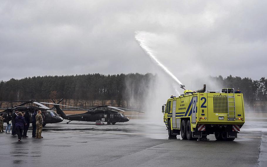 Malik and Damien Nelson, who have a condition called spasticity, are treated to a private vehicle display where water was shot out of a military fire truck, March 18, 2017.