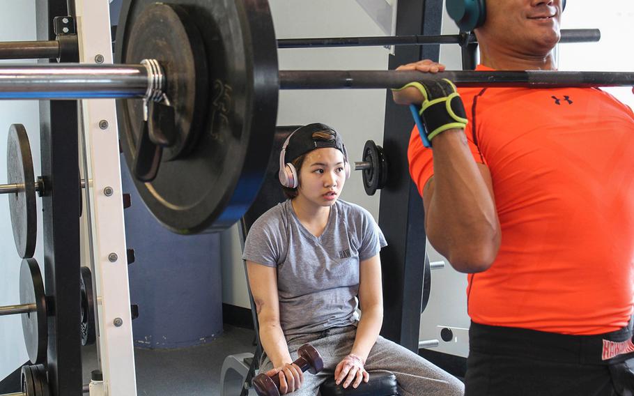 Kianni Martinez and her father, Air Force Lt. Col. Kato Martinez, conduct physical therapy at the Center for the Intrepid at Fort Sam Houston in San Antonio on Feb. 6, 2017. Martinez trains to recover her strength following her injuries in the Brussels airport bombing last March, while preparing for the rigors of Air Force ROTC.