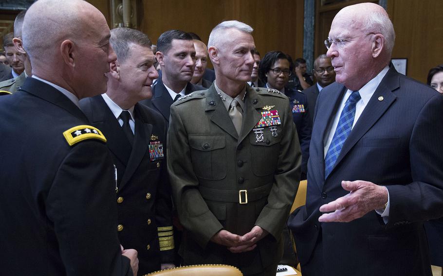 Sen. Patrick Leahy, D-Vt., talks with, left to right, Lt. Gen. Charles D. Luckey, chief of the Army Reserve; Vice Adm. Luke M. McCollum, chief of the Navy Reserve; and Lt. Gen. Rex C. McMillian, commander of Marine Corps Forces Reserve before a Senate Appropriations Subcommittee on Defense hearing on National Guard and Reserve programs and readiness, April 26, 2017, in Washington, D.C.