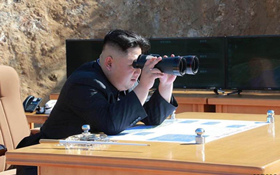North Korean leader Kim Jong Un watches what North Korea claims was its first successful test of an intercontinental ballistic missile on July 4, 2017.