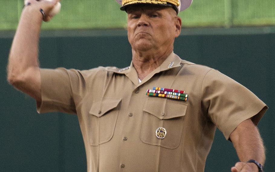 U.S. Marine Corps Commandant Gen. Robert Neller throws the ceremonial first pitch before a game between the Washington Nationals and Milwaukee Brewers at Nationals Park in Washington, D.C., July 25, 2017.
