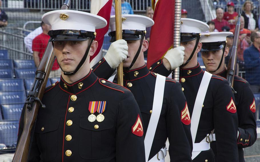 The Marine Corps Color Guard from Marine Barracks Washington marches onto the field before a game between the Washington Nationals and Milwaukee Brewers at Nationals Park in Washington, D.C., July 25, 2017.
