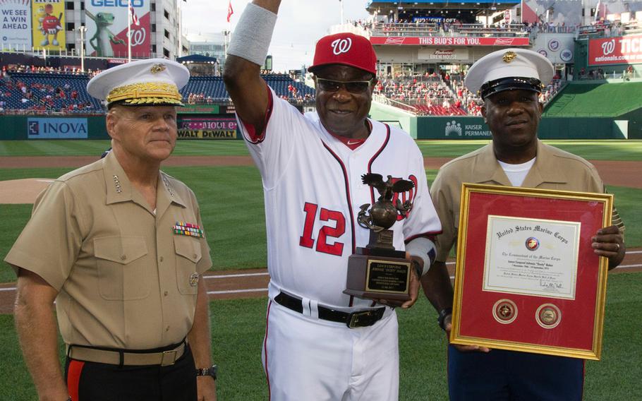 Washington Nationals manager Dusty Baker poses with U.S. Marine Corps Commandant Gen. Robert Neller, left, and Sergeant Major of the Marine Corps Ronald L. Green during a ceremony marking Baker's induction into the Marine Corps Sports Hall of Fame. Baker served as a Marine Reservist from 1968 to 1974.