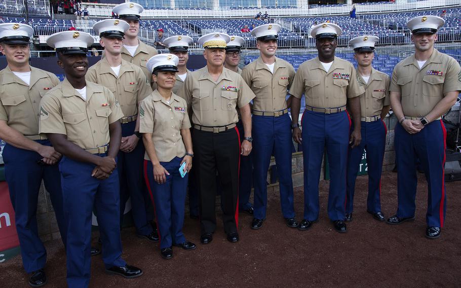 U.S. Marines pose with Commandant Gen. Robert Neller and Sergeant Major of the Marine Corps Ronald L. Green before a game between the Washington Nationals and Milwaukee Brewers at Nationals Park in Washington, D.C., July 25, 2017.