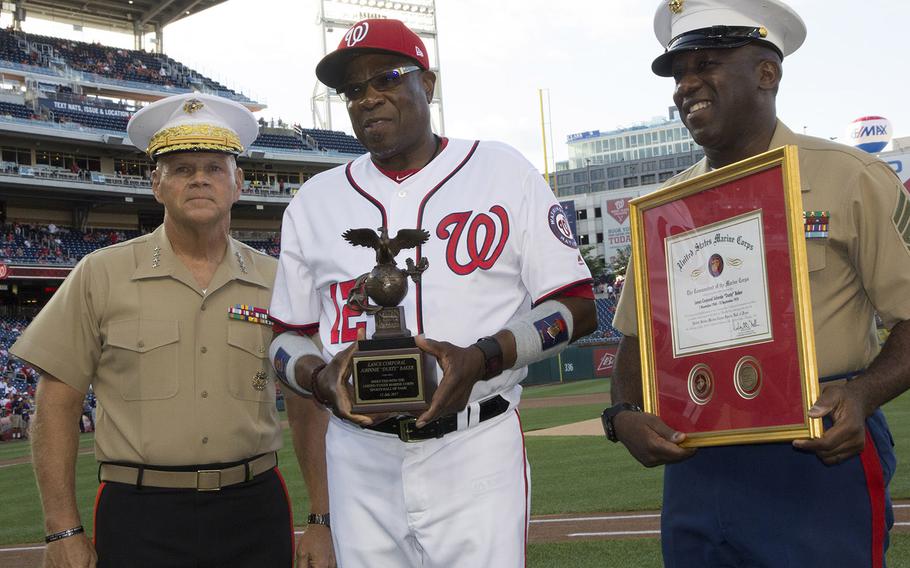 Washington Nationals manager Dusty Baker poses with U.S. Marine Corps Commandant Gen. Robert Neller, left, and Sergeant Major of the Marine Corps Ronald L. Green during a July, 2017 ceremony marking Baker's induction into the Marine Corps Sports Hall of Fame. Baker served as a Marine Reservist from 1968 to 1974.