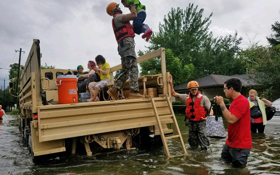 Texas National Guard soldiers arrive in Houston, Texas to aid citizens in heavily flooded areas from the storms of Hurricane Harvey.