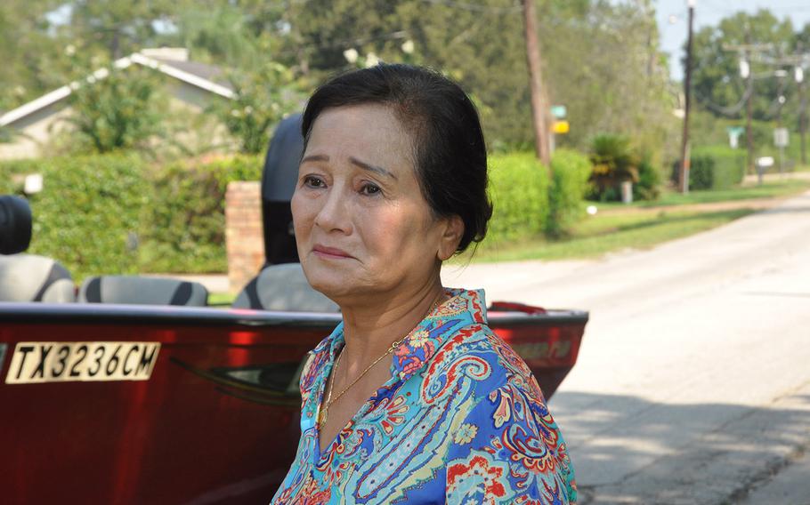 Van Ngo, a resident of Beaumont, Texas, takes a moment to recover after seeing her flooded home and neighborhood in Beaumont. Ngo’s home had just a few centimeters of water by the time she returned, while neighborhoods not far away were submerged up to 11 feet.