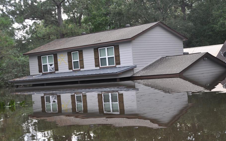 Flooding in a Beaumont, Texas neighborhood near the Pinewell Bayou left homes underwater and vehicles submerged. The water was still high on Sept. 2, 2017, but had started to recede.