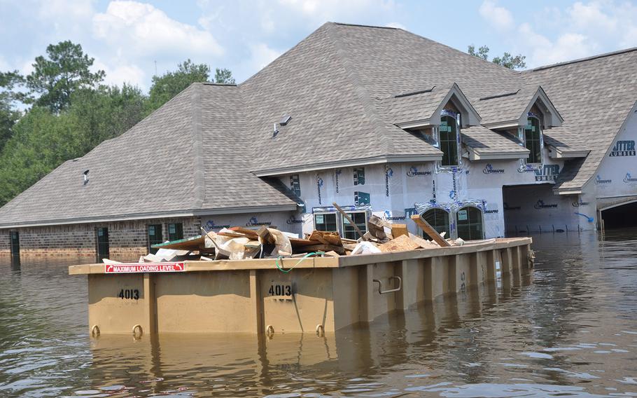 Flooding in a Beaumont, Texas neighborhood near the Pine Island Bayou left homes underwater and vehicles submerged. The water was still high on Sept. 2, 2017, but had started to recede.