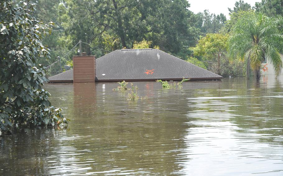 Flooding in a Beaumont, Texas neighborhood near the Pine Island Bayou left homes underwater and vehicles submerged. The water was still high on Sept. 2, 2017, but had started to recede.