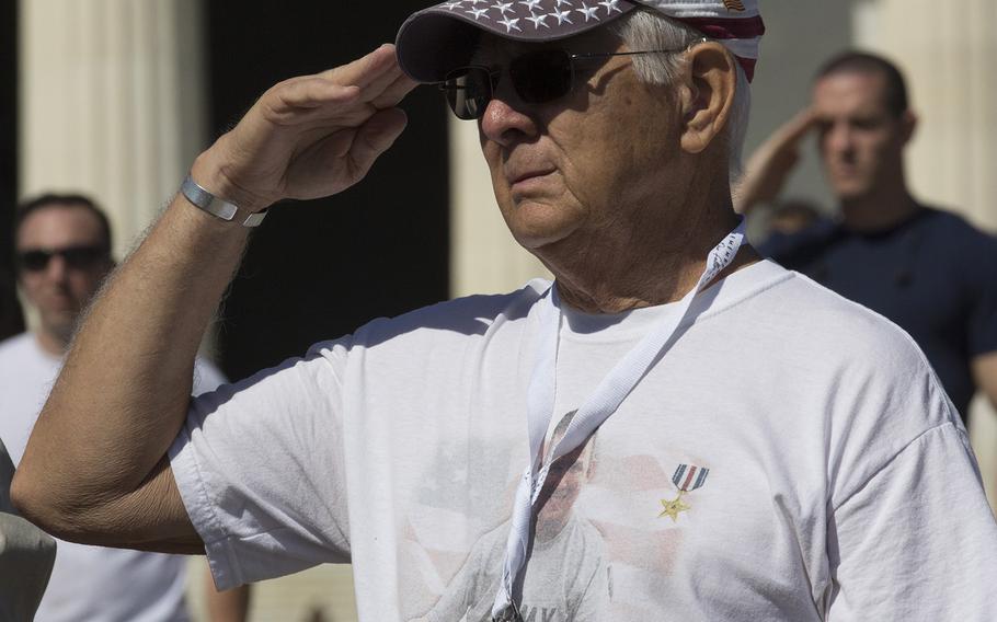 A Gold Star family member salutes during a ceremony for "Remembering Our Fallen," a traveling tribute to those who have died since 9/11 in the war against terrorism, September 7, 2017 at the Lincoln Memorial in Washington, D.C.