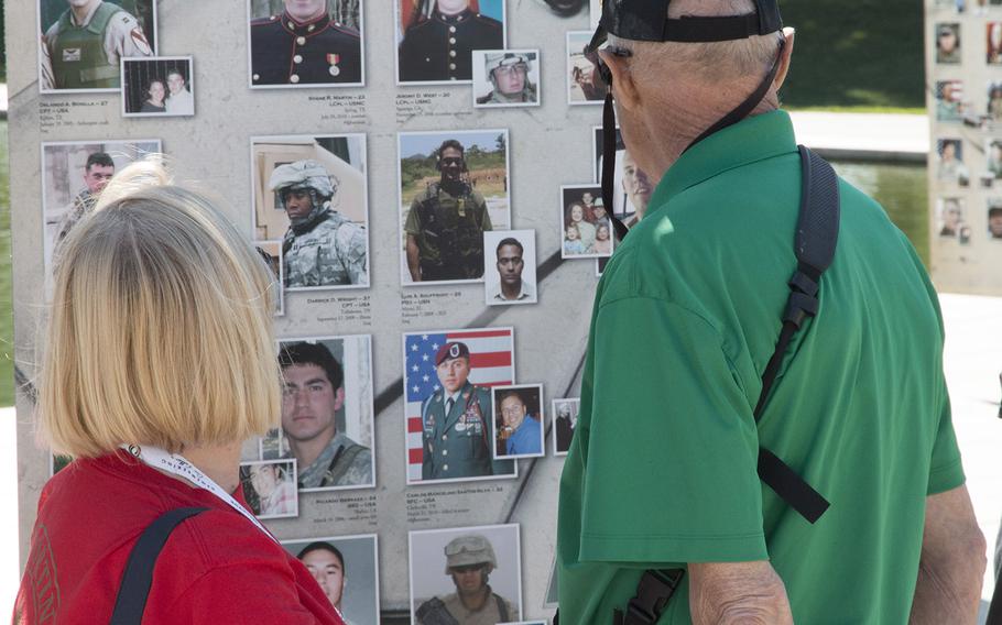 Gold Star parents Stan and Shirley White look art one of the panels from "Remembering Our Fallen," a traveling tribute to those who have died since 9/11 in the war against terrorism, September 7, 2017 at the Lincoln Memorial in Washington, D.C.