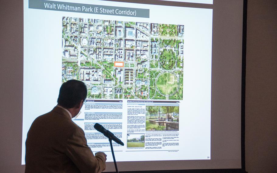 Alan Harwood, an excutive with the AECOM design firm working with the National Desert Storm and Desert Shield Memorial group, makes a presentation for the possible sites for a memorial during a hearing before the U.S. Commission of Fine Arts in Washington, D.C., on Thursday, Oct. 19, 2017. The slide displayed on the screen shows the memorial group's second choice at Whitman Park on E Street, just two blocks west of the White House complex.