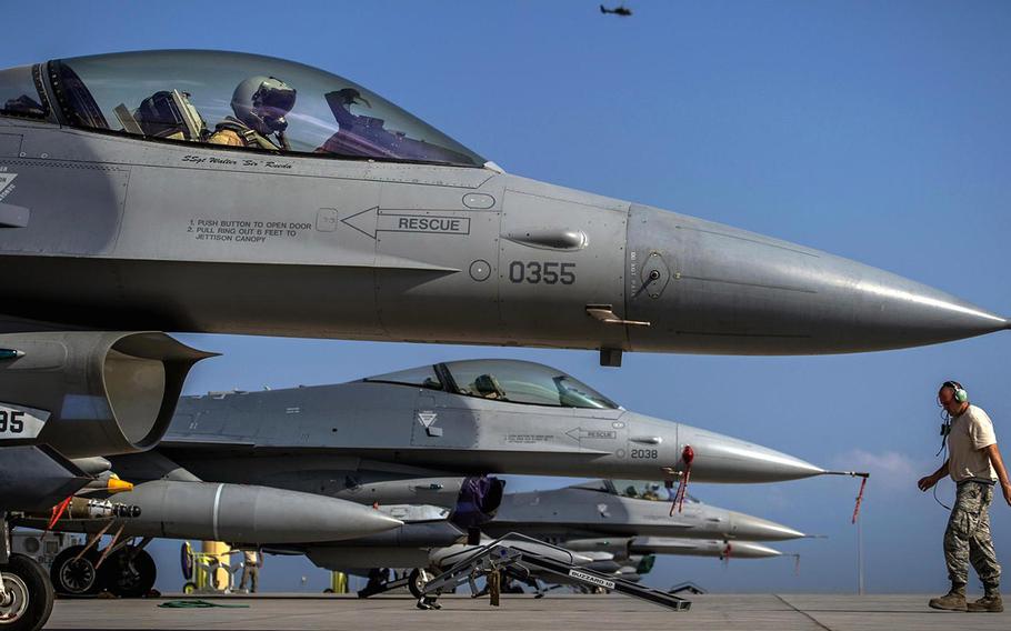 F-16 pilots prepare for takeoff during training exercise at Camp Lemonnier, Djibouti.
