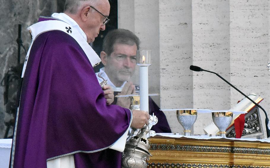 Pope Francis burns incense during his All Souls Day Mass to honor the war dead Thursday Nov. 2, 2017 at the Sicily-Rome American Cemetery in Nettuno, Italy.