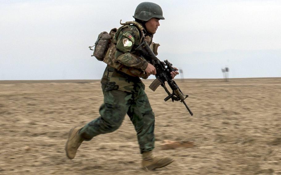 An Afghan National Army Commando races to the objective during training at Camp Pamir, Kunduz province, Afghanistan, Feb. 13, 2018.