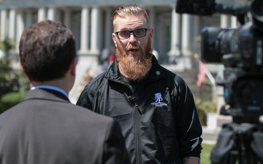 Deven Schei, a former Army combat engineer and current participant in the Wounded Warrior Project Soldier Ride, speaks to a reporter on the White House lawn on Thursday, April 26, 2018.