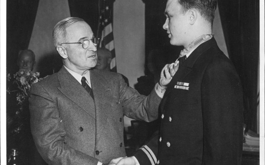 President Harry S. Truman presents the Medal of Honor to Richard M. McCool Jr. in 1945.