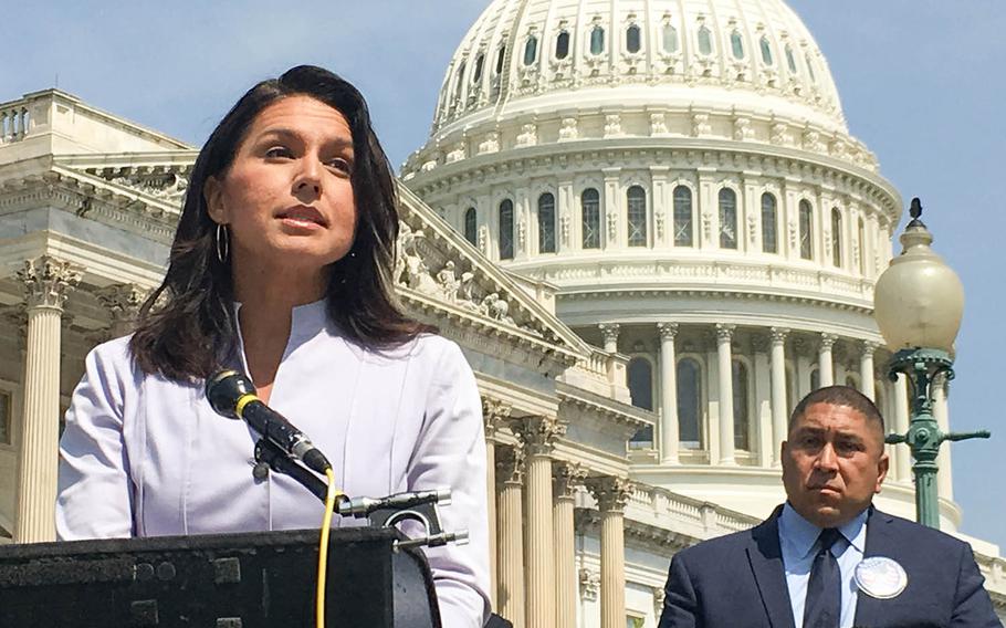 Rep. Tulsi Gabbard, D-Hawaii, speaks in front of the U.S. Capitol at a news conference about the need for Congress to support legislation creating better medical benefits for veterans suffering from illnesses contracted due to exposure to burn pits. 