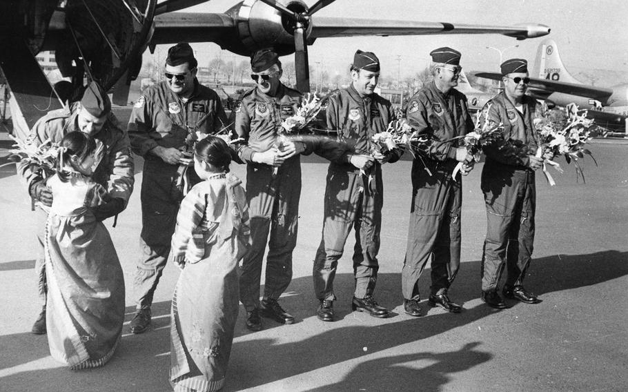 Tech Sgts. Richard Yoscak
and James Sherman, Chief Master. Sgt. David Cunningham, Majs. William Dobson and Douglas Hanks and Col. Kenneth Johnson are welcomed by South Korean youth after delivering a C124C Globemaster to a proposed Korean War museum in Seoul, May 16, 1973. 