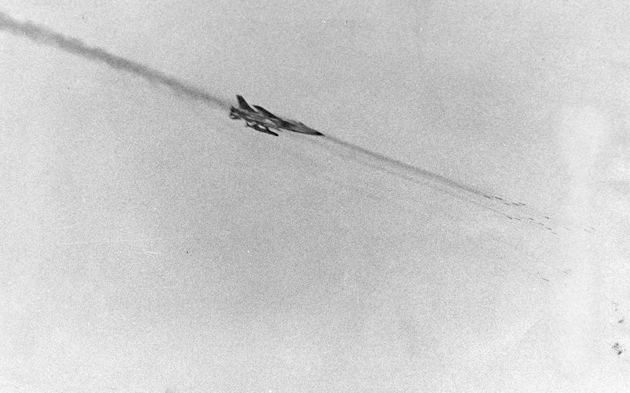 A U.S. jet fires a string of rockets at a target on Nightmare Range near the Korean demilitarized zone, January 1966. 