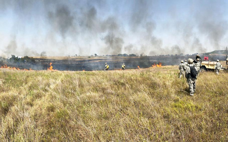 Soldiers from the 3rd Brigade Combat Team battle a fire on the Fort Hood range.
