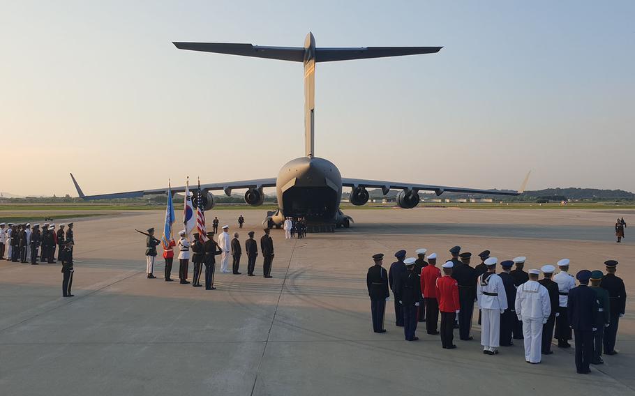Remains recently handed over by North Korea are loaded onto an Air Force transport plane at Osan Air Base, South Korea, for their trip to Hawaii, Wednesday, Aug. 1, 2018. 