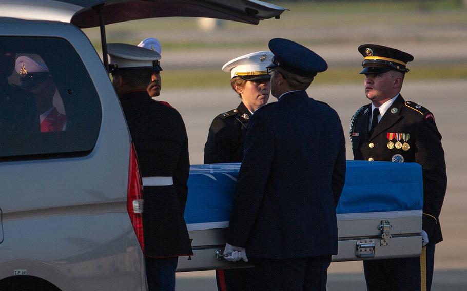 A multinational honor guard unloads a casket from a van at Osan Air Base, South Korea. The casket was headed to Hawaii on Wednesday, Aug. 1, 2018.