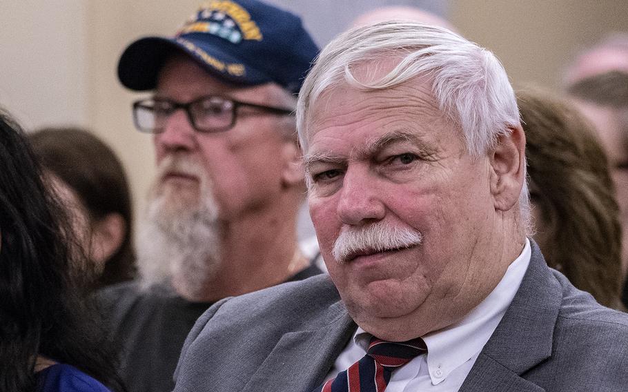 Retired Cmdr. John Wells, executive director of the Military Veterans Advocacy, Inc., listens to testimony on Wednesday, Aug. 1, 2018, during a Senate Veterans Affairs Committee hearing on Capitol Hill in Washington. "We're disappointed in the testimony of the undersecretary," Wells said after the hearing.