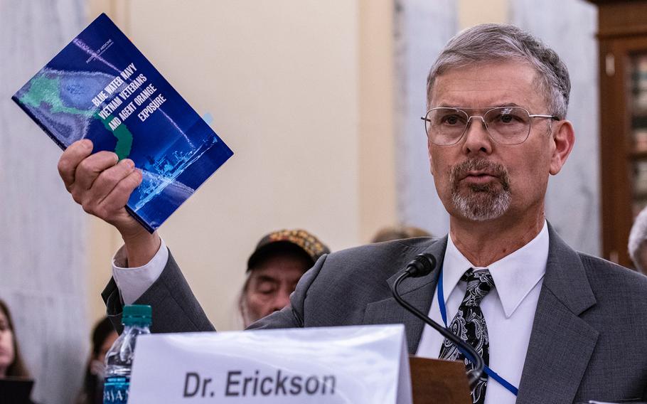Dr. Ralph Erickson, a VA expert on post-deployment health issues, holds up a pamphlet addressing the Blue Water Navy veterans, while giving testimony on Wednesday, Aug. 1, 2018, at a Senate Veterans Affairs Committee hearing, as members heard arguments for and against the Blue Water Navy Vietnam Veterans Act. Erickson told senators most of the ailments presumed to be caused by Agent Orange also are tied to aging.