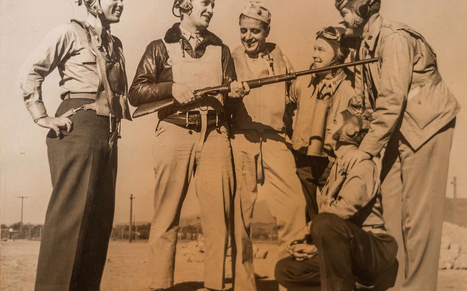 Sam Folsom, kneeling right, is photographed in 1944 with other servicemembers who had served in his Marine fighter squadron, VMF 121, at Guadalcanal in World War II two years earlier. The unit's executive officer Joe Foss, second from left holding the rifle, was a renowned fighter pilot who earned ace status, shooting down 26 Japanese aircraft at Guadalcanal, and earned the Medal of Honor for his actions in that battle. He went on to become a brigadier general in the South Dakota National Guard and served as that state's governor. 