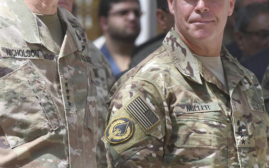 Gen. Austin Scott Millr, right,  assumed command of NATO forces in Afghanistan from Gen. John Nicholson  in a ceremony Sunday at Resolute Support Headquarters in Kabul. 




