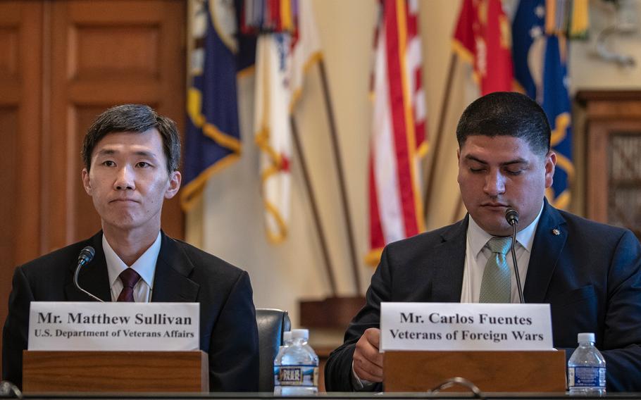 Matthew Sullivan, a deputy undersecretary with the VA’s National Cemetery Administration and Carlos Fuentes, director of the Veterans of Foreign Wars, prepare to testify before the House Committee on Veterans' Affairs on Wednesday, Sept. 5, 2018, on Capitol Hill in Washington.