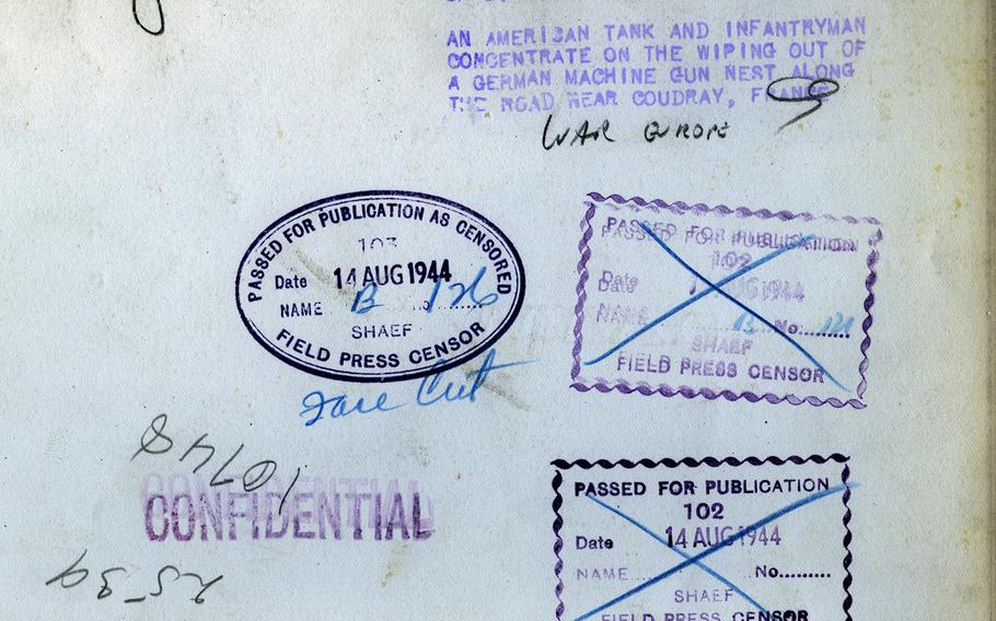 Various censors' stamps on the back of the tank photo.