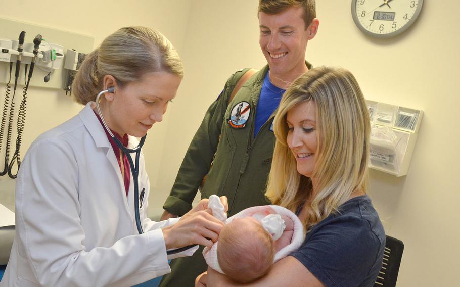Lt. Jacob Balesi, a flight officer with Patrol Squadron Thirty (VP-30), and his family visit Naval Hospital Jacksonville’s pediatrics clinic on Aug. 30, 2018. Hospitals and clinics at Fort Bragg, N.C.; Naval Air Station Jacksonville, Fla.; Keesler Air Force Base, Miss.; Joint Base Charleston, S.C.; and Seymour Johnson Air Force Base, N.C., came under DHA control in October.