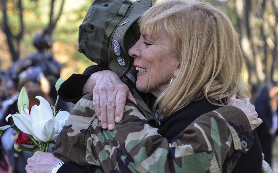 Jane McCarthy, left, hugs Janis Nark, right, at the Vietnam Women's Memorial on Sunday, Nov. 11, 2018. Both women were part of the Army Nurse Corps. Nark began to cry while recounting some of the patients she treated in Vietnam.